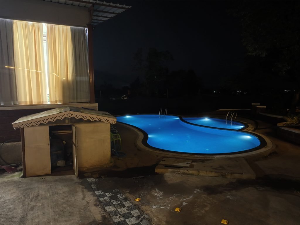 Enjoy a luxurious swim in Prathamesh Valley Resort's pool