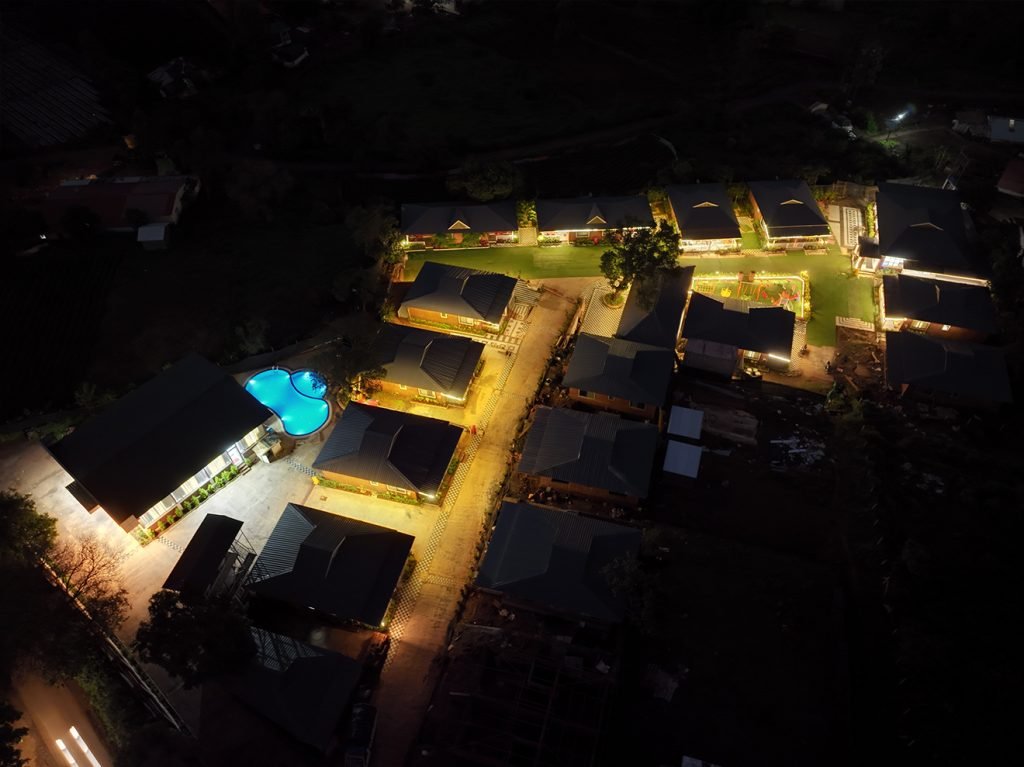 Aerial view of Prathamesh Valley Resort surrounded by nature.